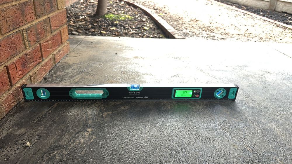 Ground sloping toward the house, holding damp soil against the footing, found during a building and pest inspection in Darley