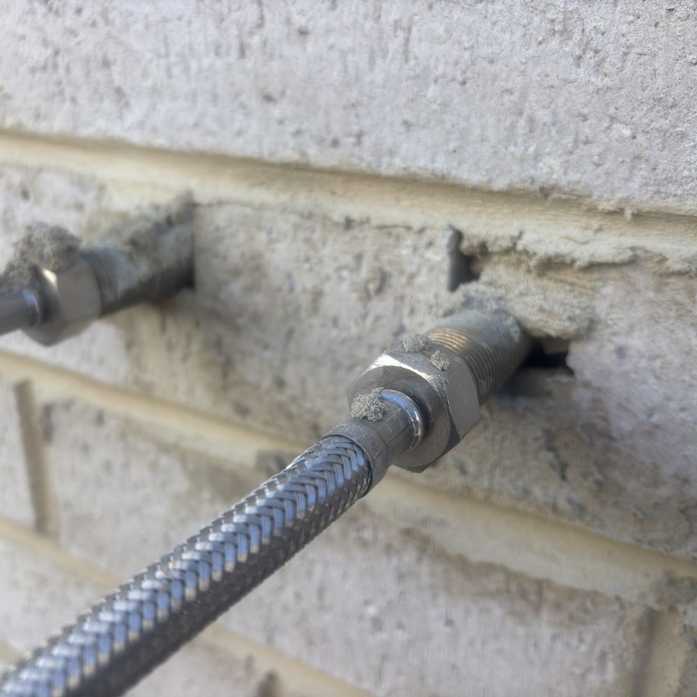 Service penetrations through the wall still to be sealed, found during a fixing inspection in Maddingley