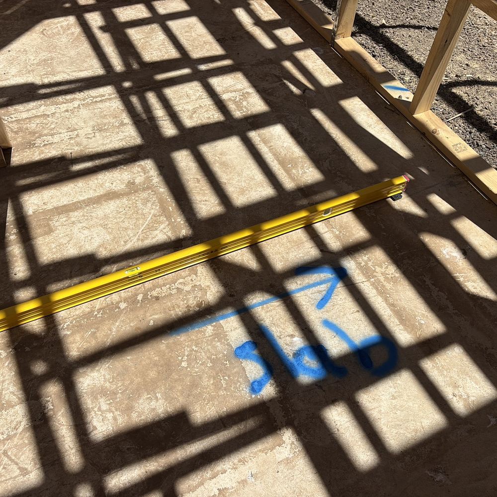 Slab out of level by more than the tolerance guide allows, found during a frame inspection in Maddingley
