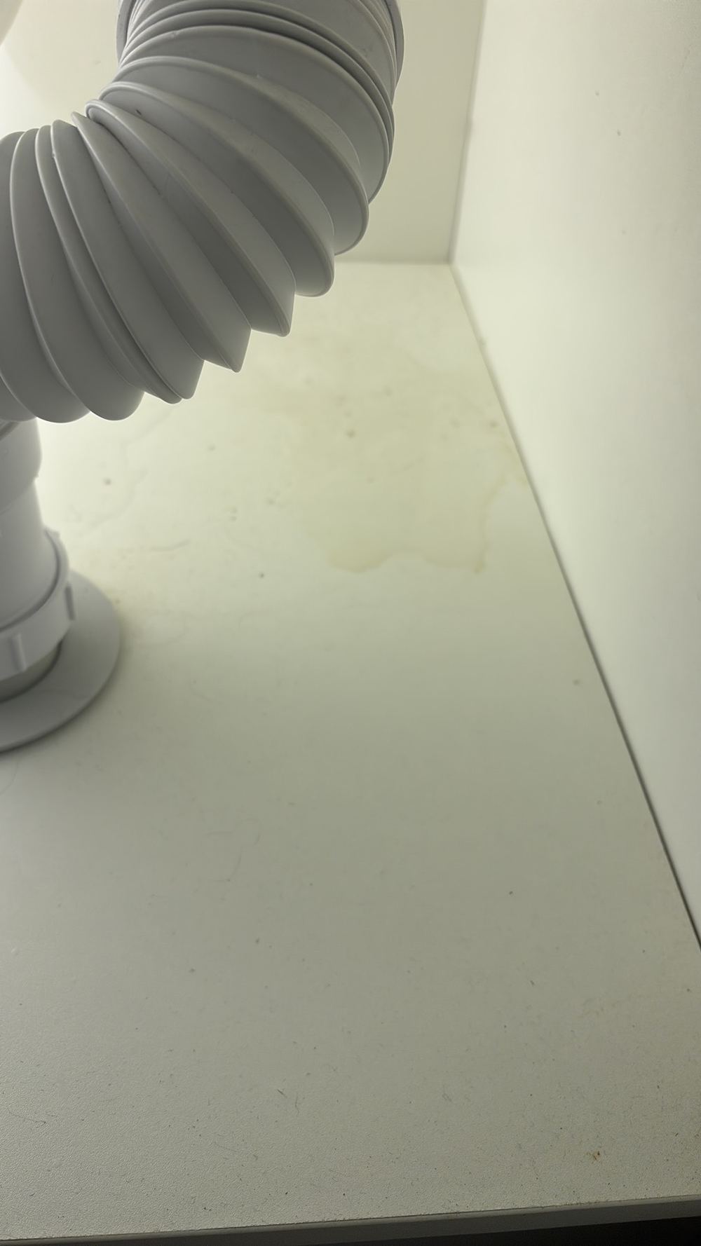 Cabinet base water damaged from a leak, needing repair, found during a pre-purchase inspection in Darley