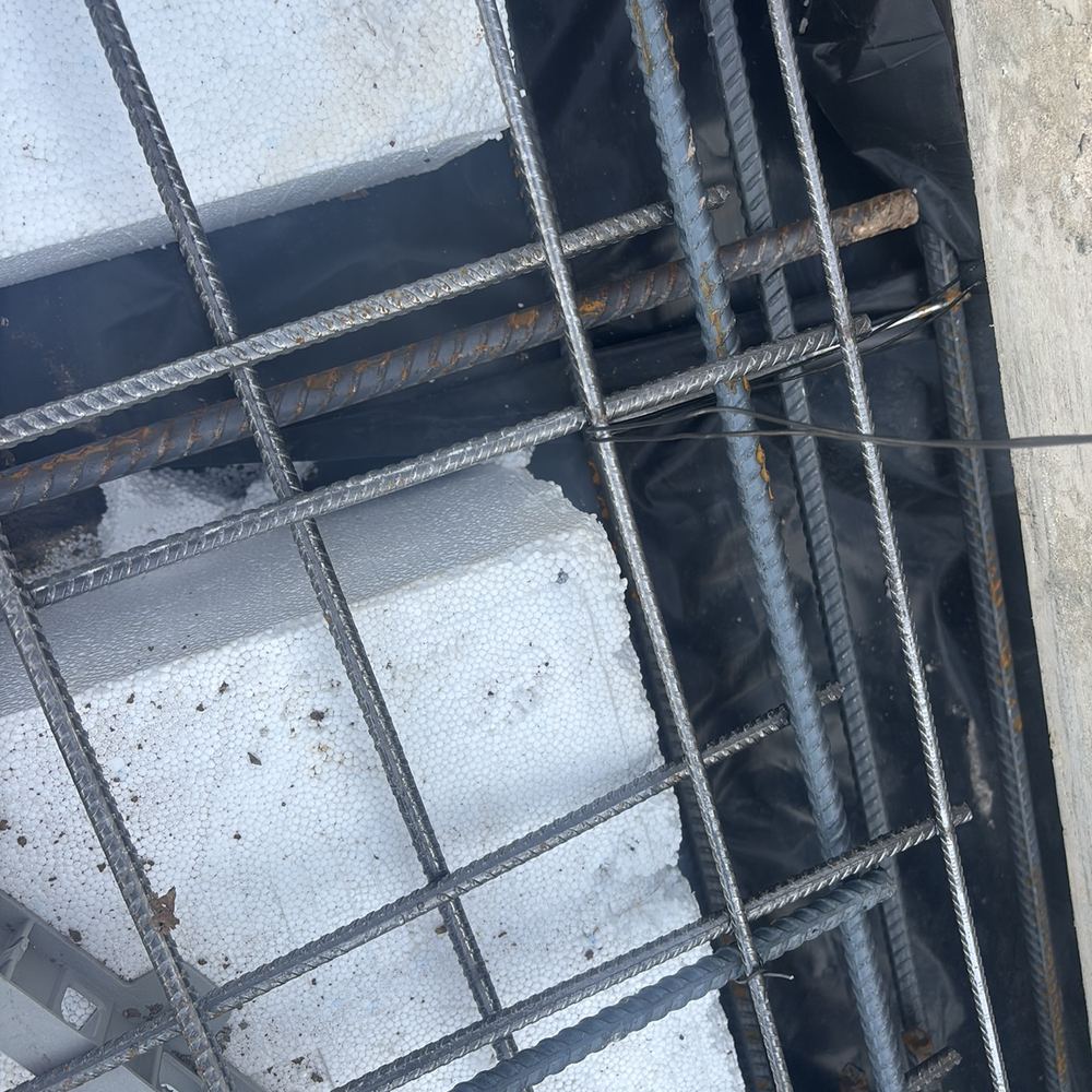Mesh needing more bar chairs to hold it up off the ground, found during a slab inspection in Maddingley