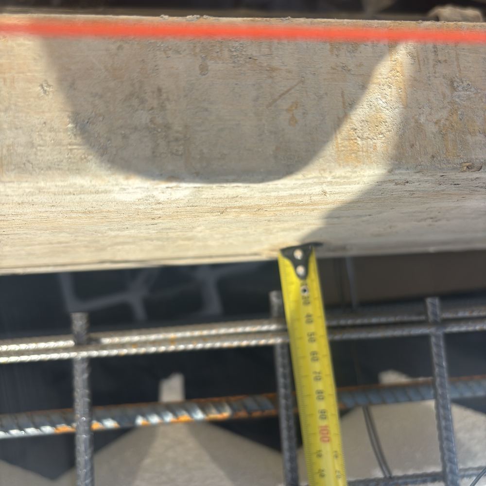 Steel sitting too close to the form face, short of the cover required, found during a slab inspection in Maddingley